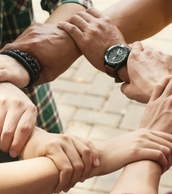cropped-friends-holding-wrists-each-othe-chain-support-collaborate cropped-friends-holding-wrists-each-othe-chain-support-collaborate